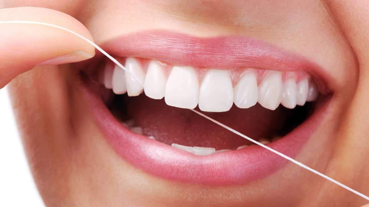 Como usar fio dental corretamente